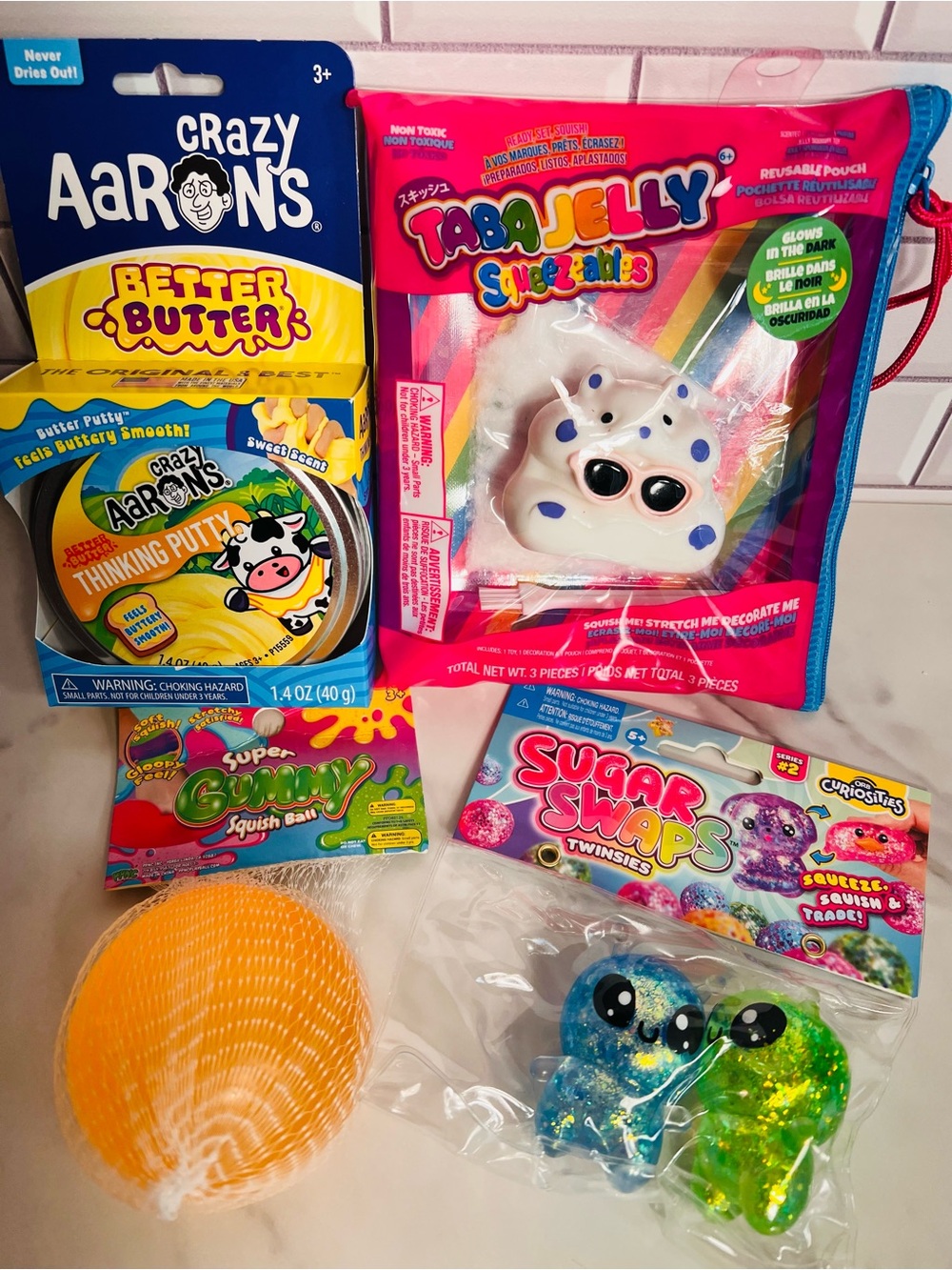 Crazy Aaron’s Butter, Squishy Gummy Ball, Sugar Swaps Twinsies Aliens, Hamster